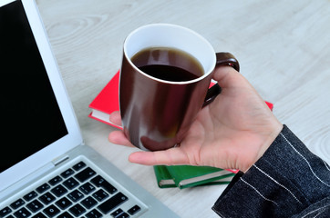 business woman hand hold a cup of coffee