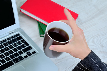  woman hand hold a cup of coffee