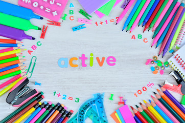 word active colors letters and objects for school on table