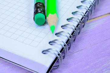 notebook with crayon on table