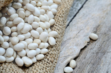white beans in sack on table