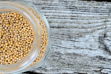 mustard seed in jar on table