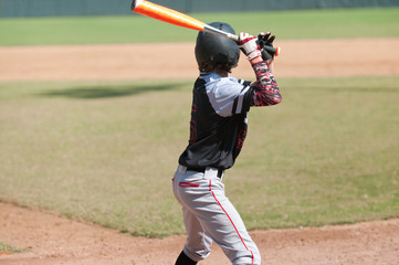American teen baseball player batting