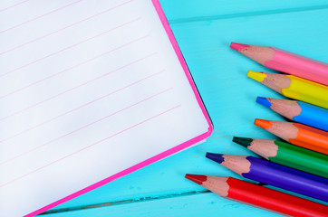 Obraz premium notebook with crayon on table