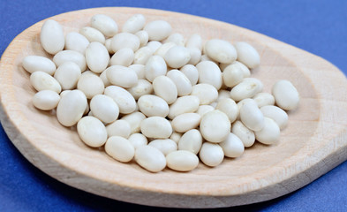 beans in spoon on table