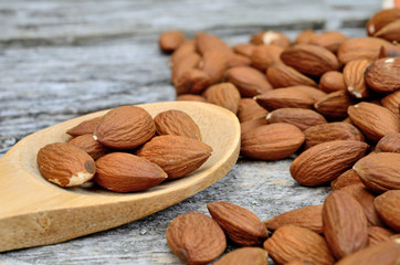 almond in spoon on table