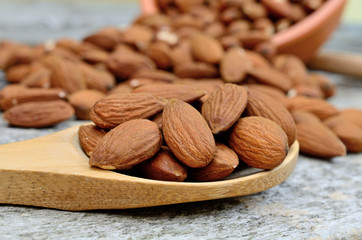 almond in spoon on table