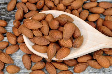 almond in spoon on table