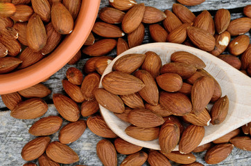 almond on table with bowl and spoon