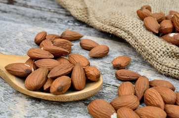 almond in spoon on table