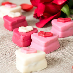 Small heart shaped chocolates with white background, ideal for y