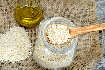 sesame in spoon on jar