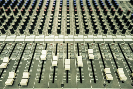 Close up control audio mixer. Vintage or retro tone.