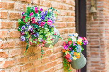 pot of flowers on the wall