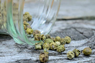 peppercorn in jar flow on table