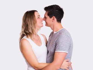 young couple in front of white background