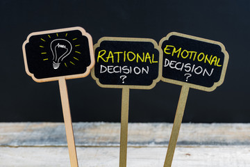 Concept message RATIONAL DECISION versus EMOTIONAL DECISION and light bulb as symbol for idea