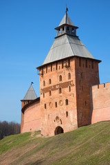 Fototapeta na wymiar Spasskaya Tower of the Novgorod detinets close up in the sunny April afternoon. Veliky Novgorod, Russia