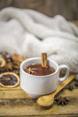 Obraz na płótnie Canvas Cup of hot tea with a cinnamon stick