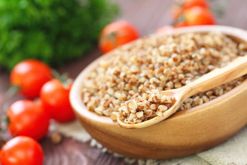 Buckwheat in bowl and fresh vegetables