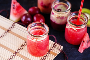 Jars with smoothies and fruits 