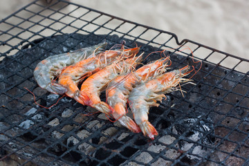 Grilled shrimps on grill.