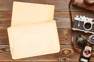 Vintage cameras and lenses on wooden background
