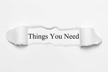 Things You Need on white torn paper