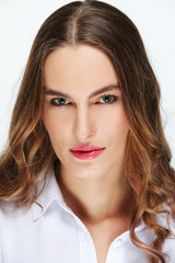 Closeup portrait of fashion model with natural makeup, blue eyes