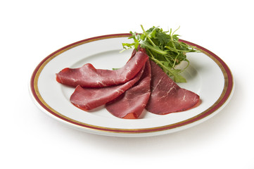 Appetizer of bresaola and arugula