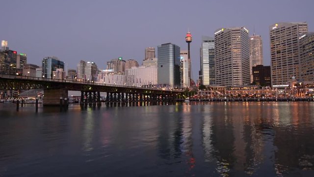 Cityscape of Darling Harbour at dusk, a recreational and pedestrian precinct situated on western outskirts of the Sydney central business district in New South Wales, Australia.