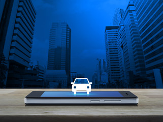 Car front view flat icon on modern smart phone screen on wooden