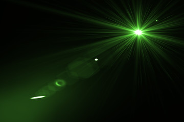 abstract lens flare green  light over black background