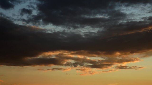 Moving clouds on sky. Sunset. Nature background.