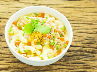Macaroni soup putting on wooden background
