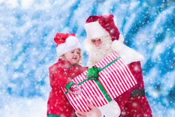Kids and Santa with Christmas presents