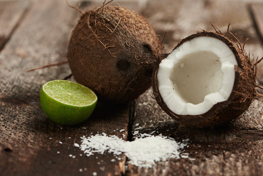 Refreshment Water Ingredients. Weight Loss Concept. Exotic Coconut And Lime On Wooden Background. 