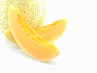 Selective focus of slice cantaloupe isolated over white