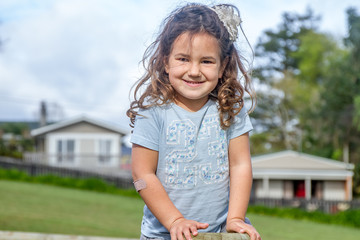 outdoor portrait of young happy child girl on natural background