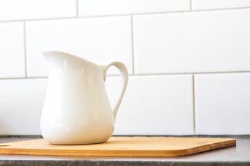 milk jug on kitchen background