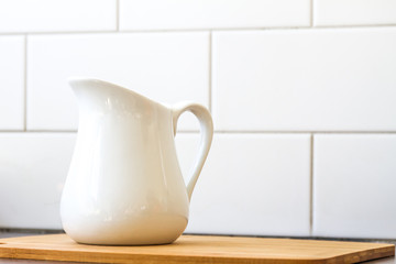 milk jug on kitchen background