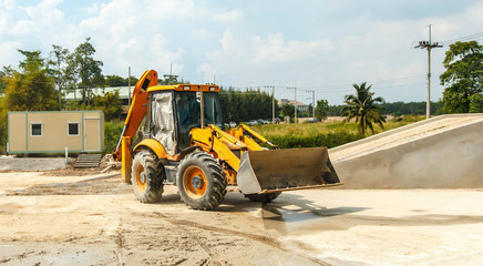 wheel loader yellow excavator earthmoving Outdoors cement.