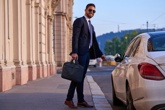 Young businessman with his car	