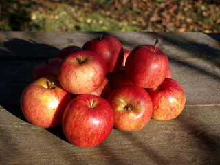 red apples on wooden background