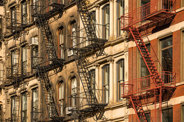 Obraz premium Soho building facades with fire escapes. Manhattan, New York City