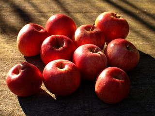 red apples on wooden background
