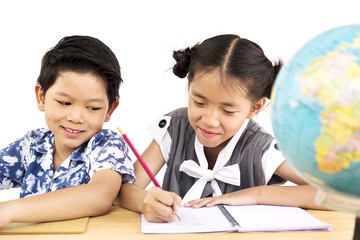 Asian kids are happily studying with blurred globe over white background