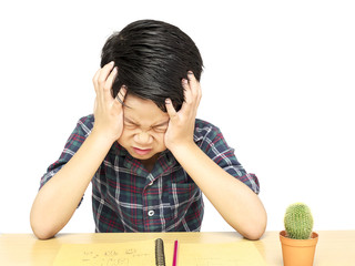Angry boy is shouting while doing his assignment