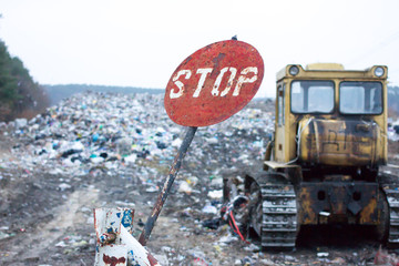 Red round stop sign, indicating that garbage at this dump has long denied. Landfill works. Lviv waste. The problem of  disposal.