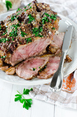 Baked meat with garlic, spices and chimichurri sauce